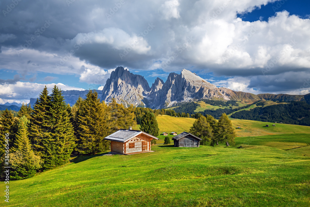 Famous Alpe di Siusi - Seiser Alm with Sassolungo - Langkofel mountain group in background at sunset