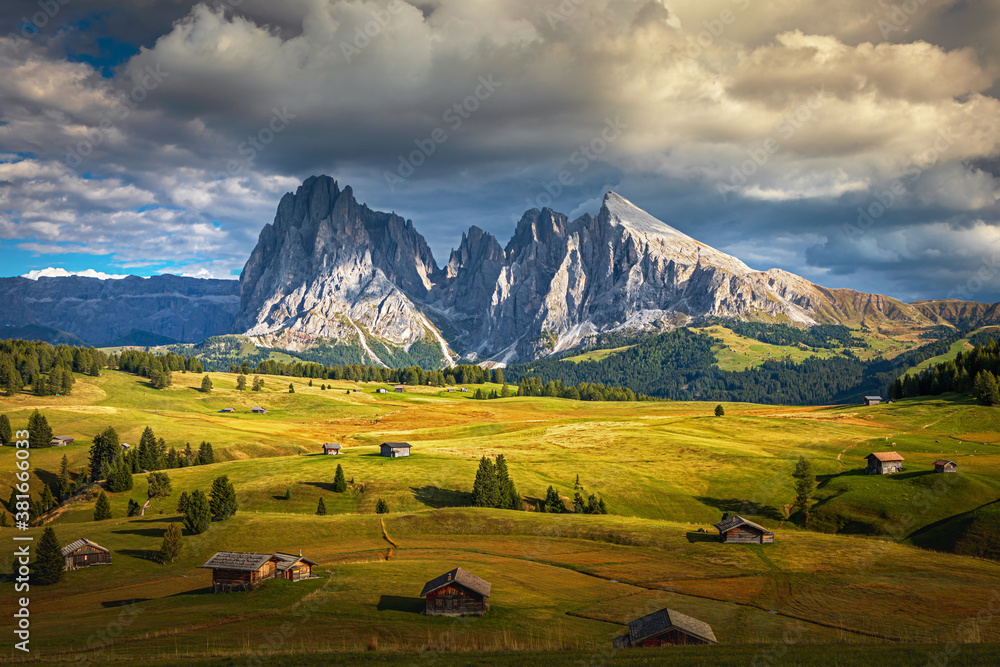 Famous Alpe di Siusi - Seiser Alm with Sassolungo - Langkofel mountain group in background at sunset