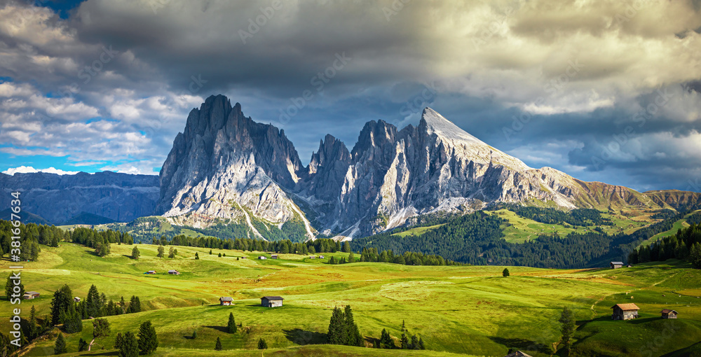 Famous Alpe di Siusi - Seiser Alm with Sassolungo - Langkofel mountain group in background at sunset