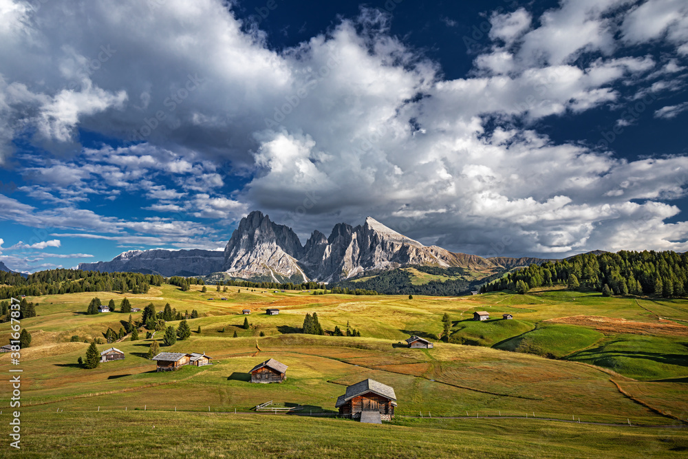 Famous Alpe di Siusi - Seiser Alm with Sassolungo - Langkofel mountain group in background at sunset