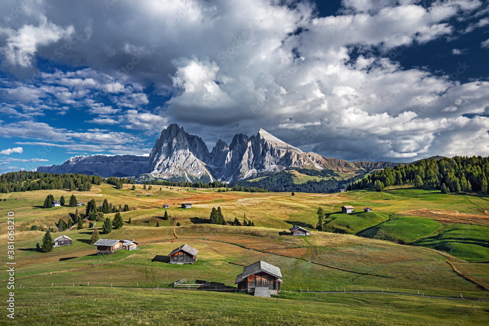 Famous Alpe di Siusi - Seiser Alm with Sassolungo - Langkofel mountain group in background at sunset