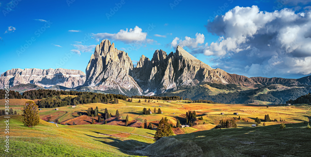 Famous Alpe di Siusi - Seiser Alm with Sassolungo - Langkofel mountain group in background at sunset