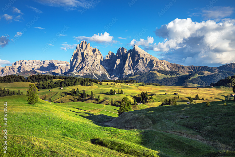 Famous Alpe di Siusi - Seiser Alm with Sassolungo - Langkofel mountain group in background at sunset