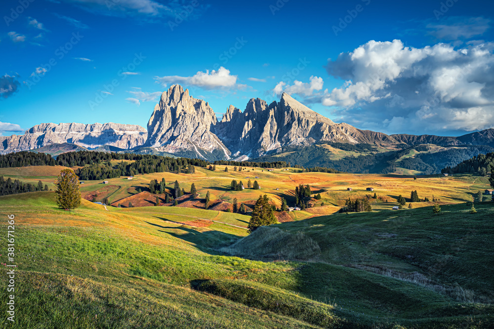 Famous Alpe di Siusi - Seiser Alm with Sassolungo - Langkofel mountain group in background at sunset