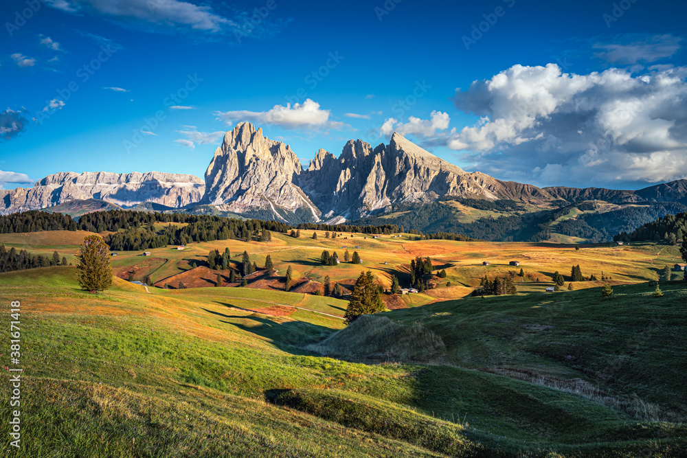 Famous Alpe di Siusi - Seiser Alm with Sassolungo - Langkofel mountain group in background at sunset