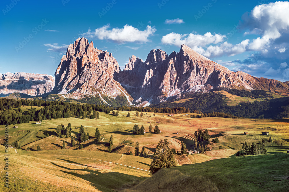 Famous Alpe di Siusi - Seiser Alm with Sassolungo - Langkofel mountain group in background at sunset