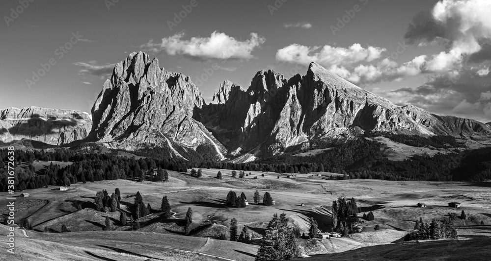 Famous Alpe di Siusi - Seiser Alm with Sassolungo - Langkofel mountain group in background at sunset