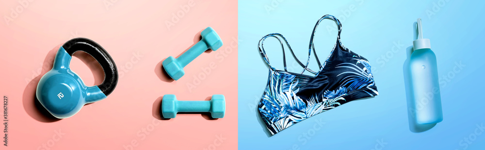 Fitness theme with dumbbells and a sportswear - flat lay