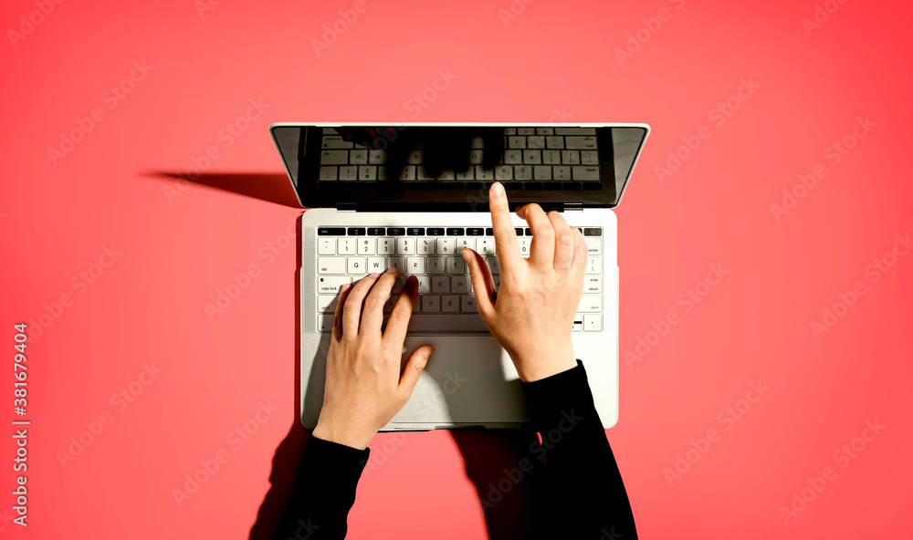 Person using a laptop computer from above