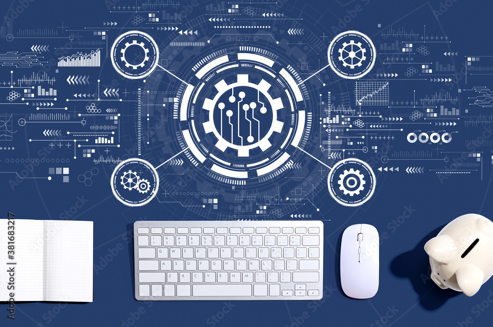 Automation concept with a computer keyboard and a piggy bank