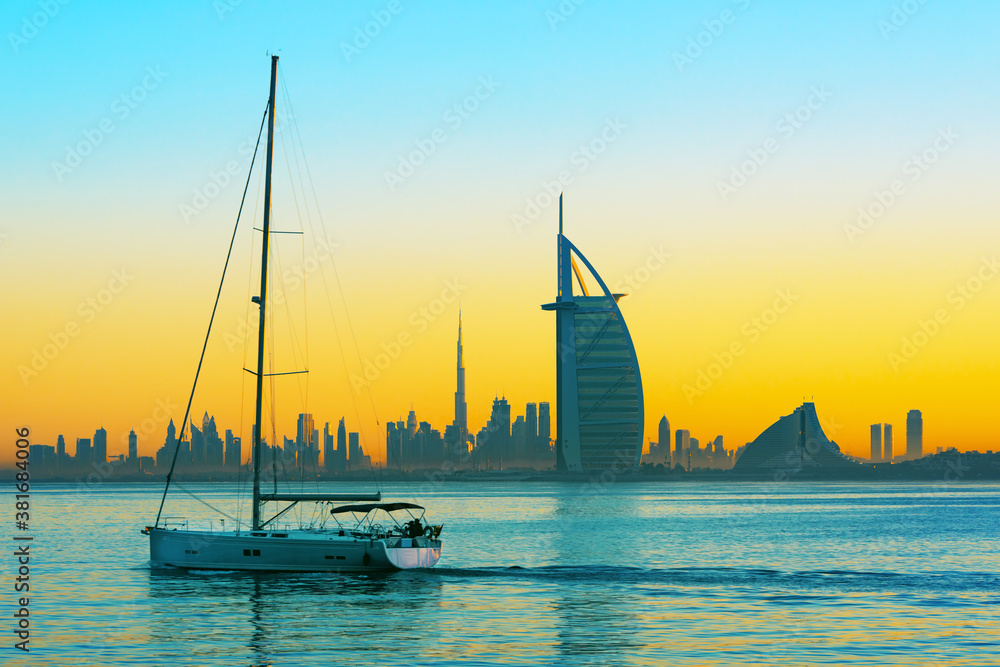 Dubai city - amazing city center skyline and famous Jumeirah beach at sunset, United Arab Emirates
