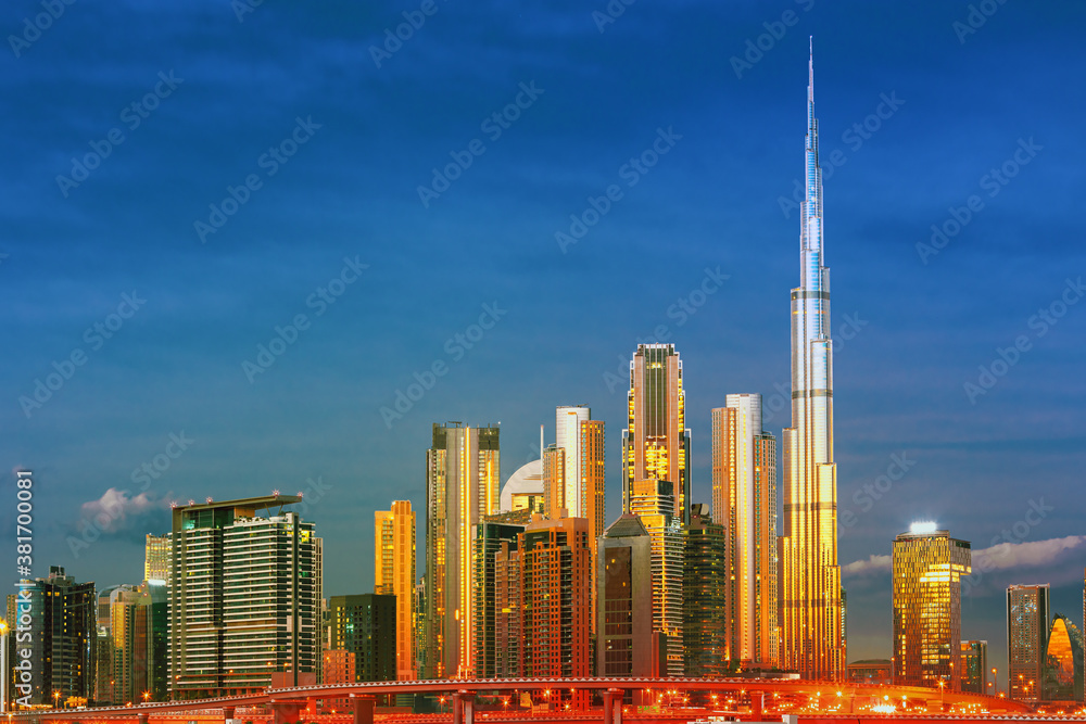 Dubai skyline with reflection in the river at sunrise , Dubai, United Arab Emirates 