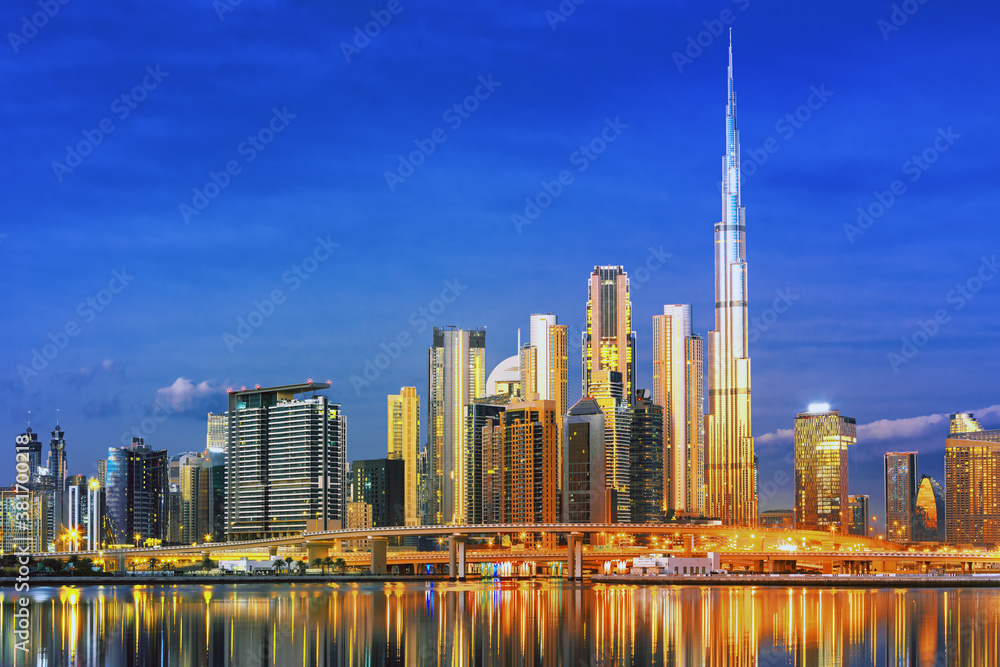 Dubai skyline with reflection in the river at sunrise , Dubai, United Arab Emirates 