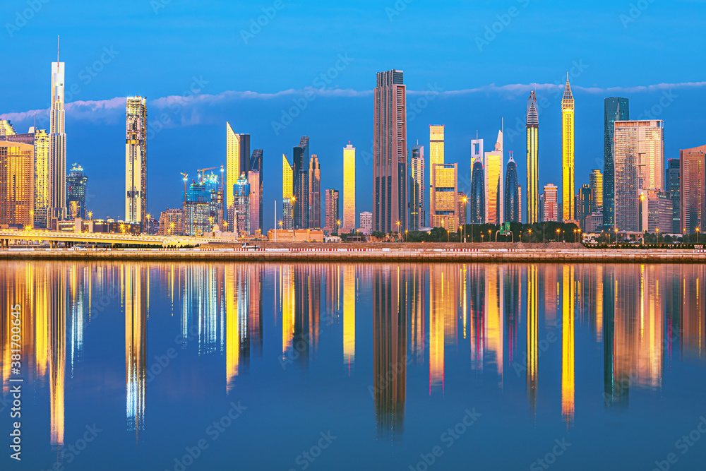 Dubai skyline with reflection in the river at sunrise , Dubai, United Arab Emirates 