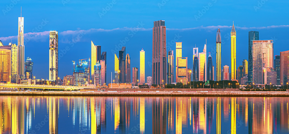 Dubai skyline with reflection in the river at sunrise , Dubai, United Arab Emirates 