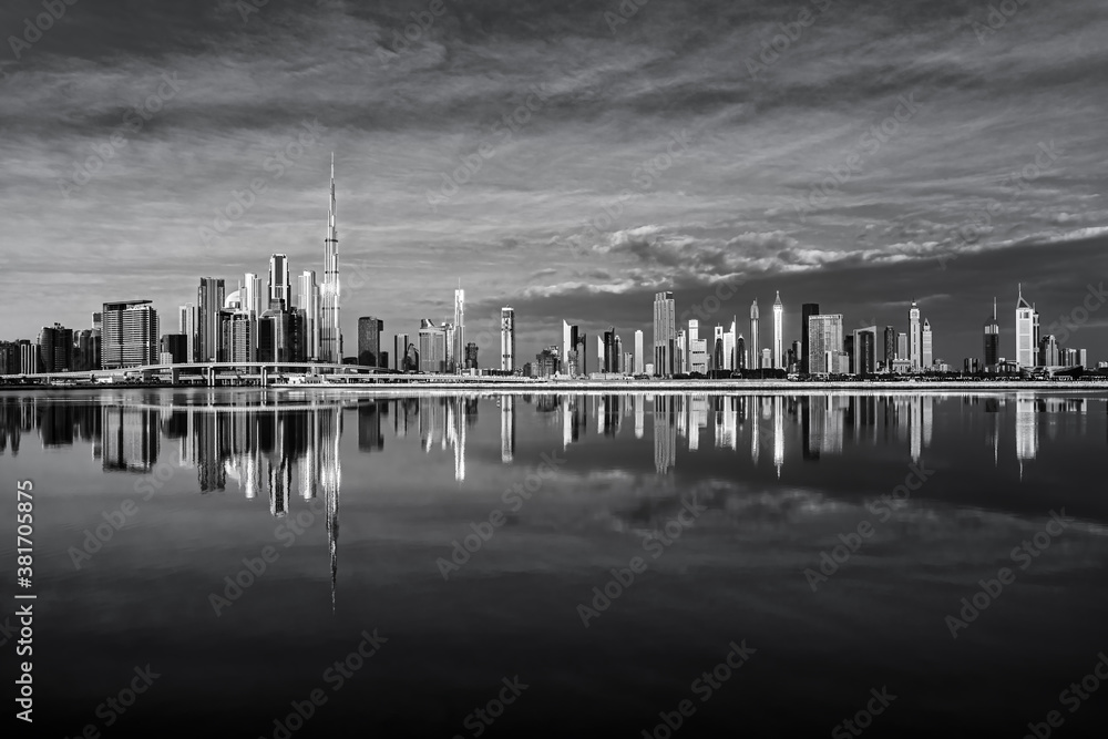 View on Dubai skyline with reflection at the sunrise, Dubai, United Arab Emirates 