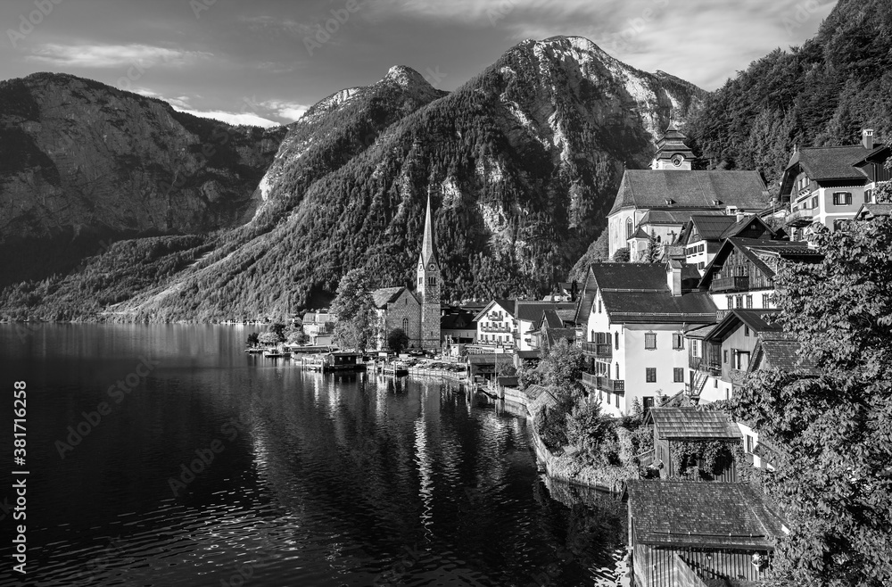 Scenic picture-postcard view of famous Hallstatt mountain village in the Austrian Alps at beautiful 