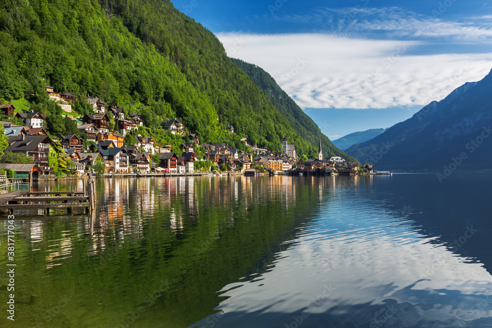 Scenic picture-postcard view of famous Hallstatt mountain village in the Austrian Alps at beautiful 