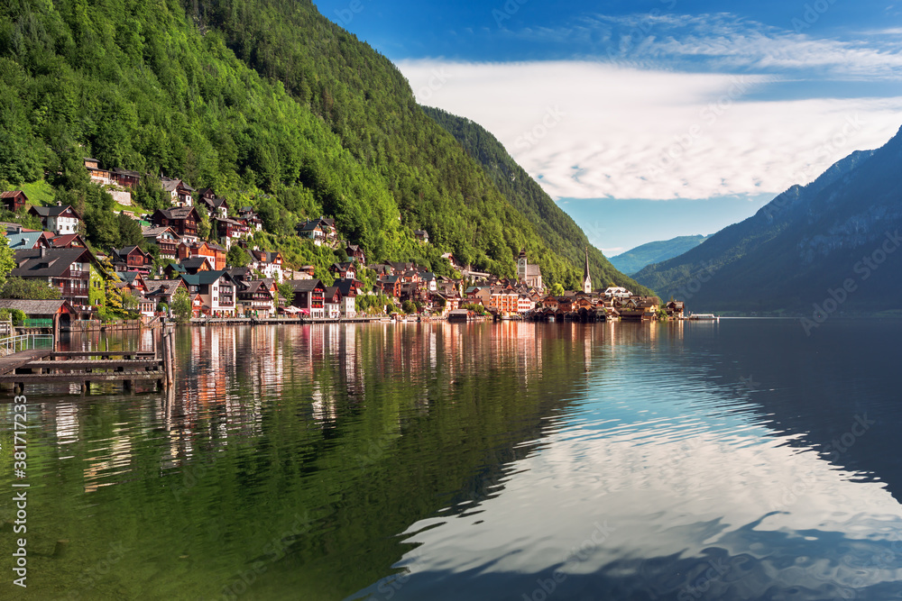 Scenic picture-postcard view of famous Hallstatt mountain village in the Austrian Alps at beautiful 