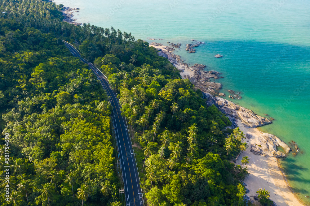 High angle view of  road pass through coconut tree forest and beautiful coastline in Khanom, Nakhon 