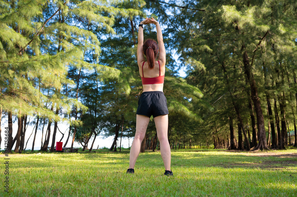 Asian sporty woman work out and stretching in morning