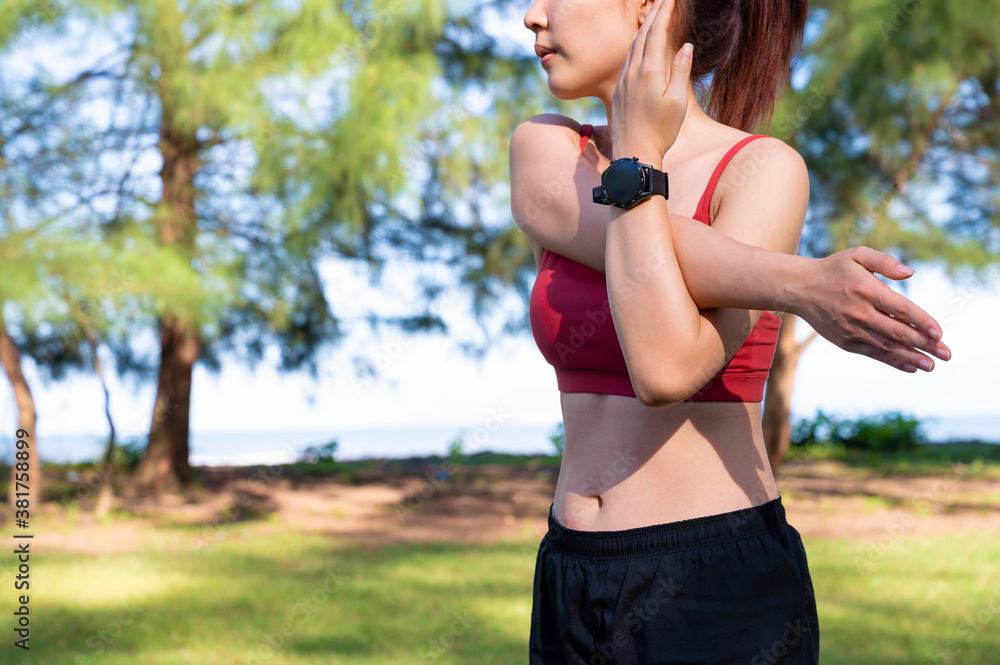 Asian sporty woman work out and stretching in morning