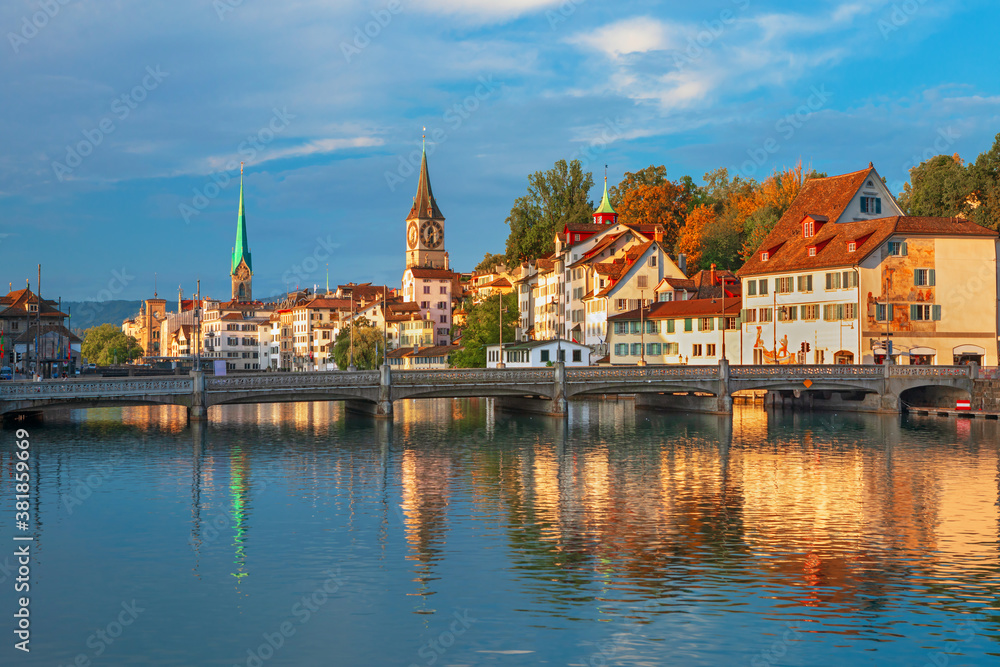 Amazing sunrise view on historic Zurich city center with famous Fraumunster and Grossmunster churche