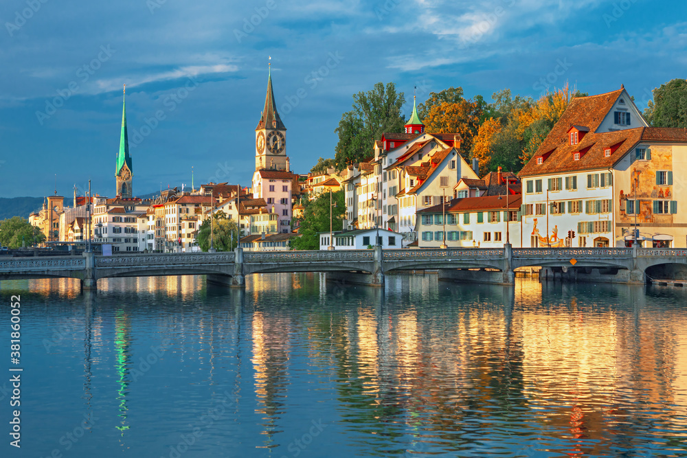 Amazing sunrise view on historic Zurich city center with famous Fraumunster and Grossmunster churche