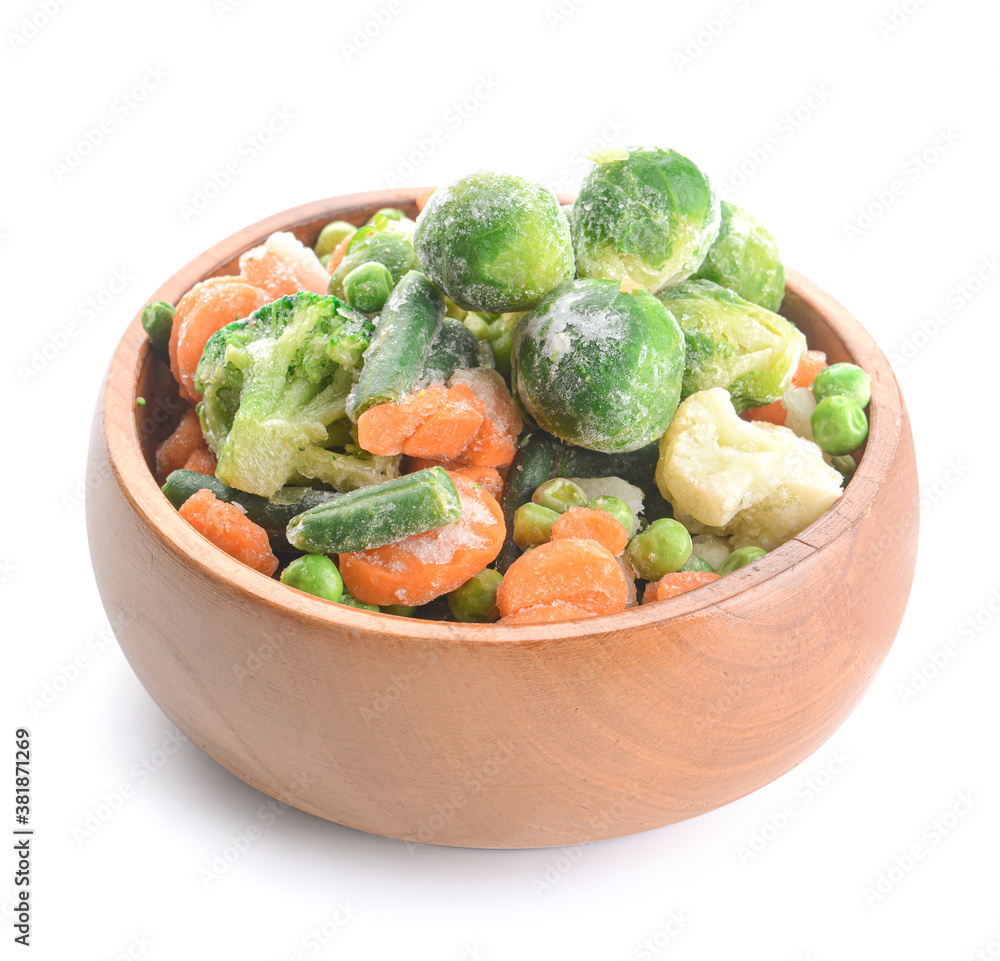 Mix of frozen vegetables in bowl on white background