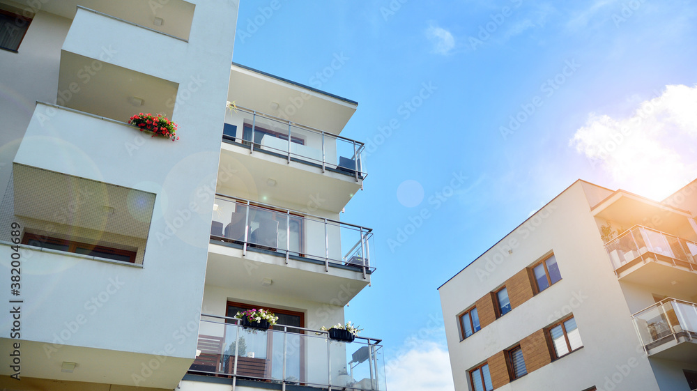 Apartment residential house and home facade architecture and outdoor facilities. Blue sky on the bac