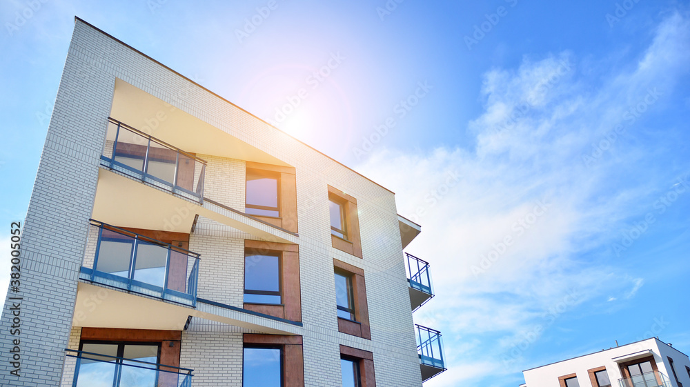 Apartment residential house and home facade architecture and outdoor facilities. Blue sky on the bac