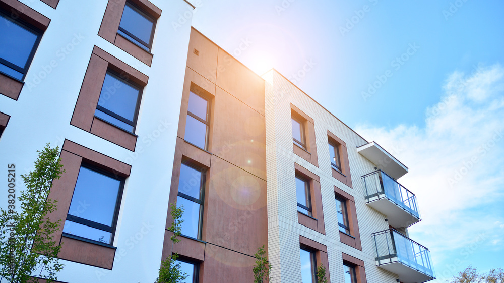 Apartment residential house and home facade architecture and outdoor facilities. Blue sky on the bac