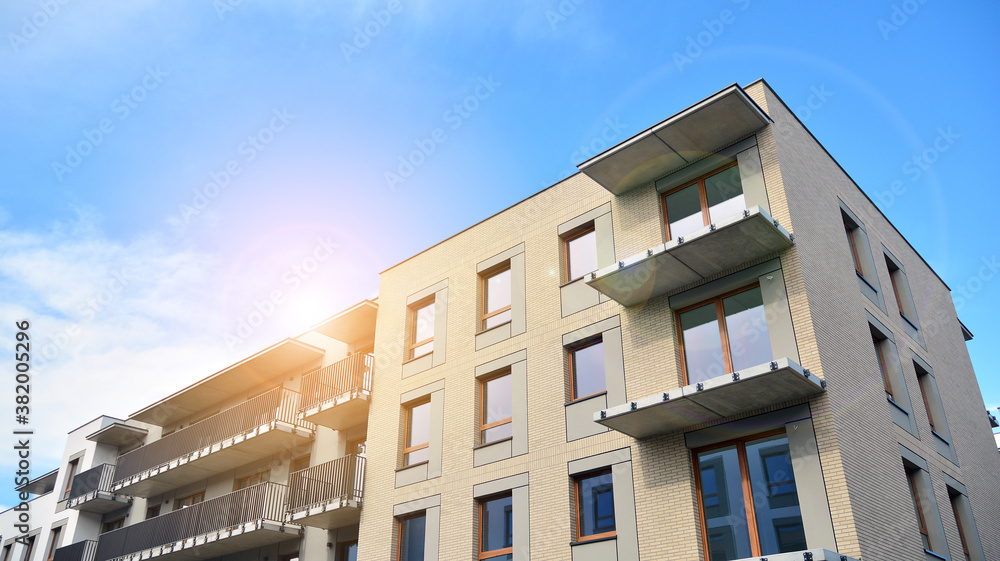 Apartment residential house and home facade architecture and outdoor facilities. Blue sky on the bac