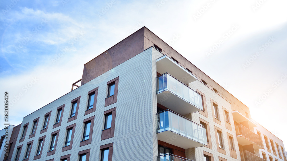 Apartment residential house and home facade architecture and outdoor facilities. Blue sky on the bac