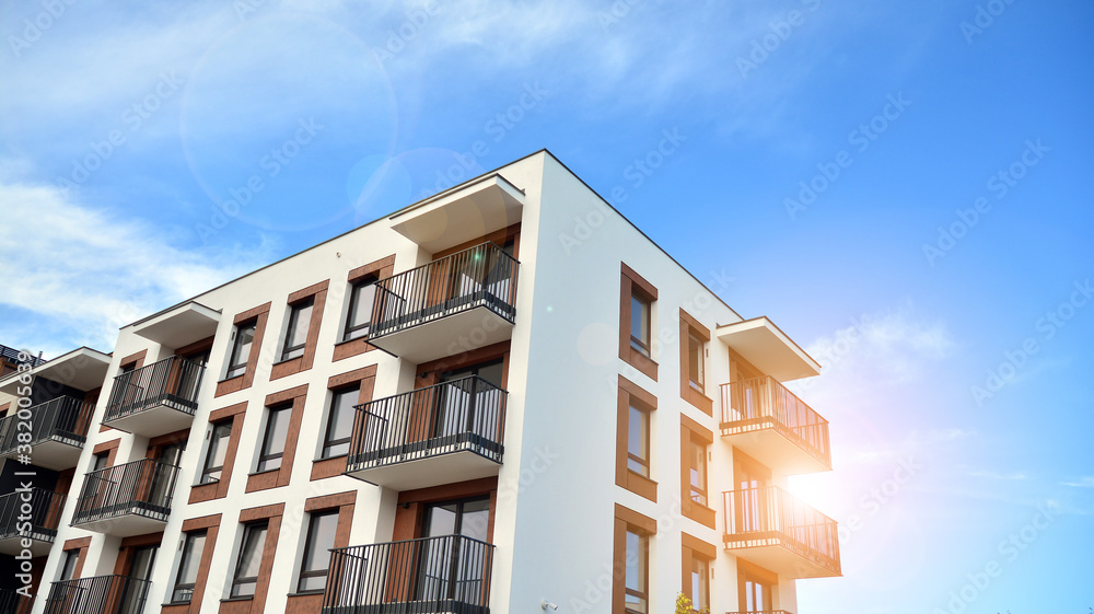 Apartment residential house and home facade architecture and outdoor facilities. Blue sky on the bac