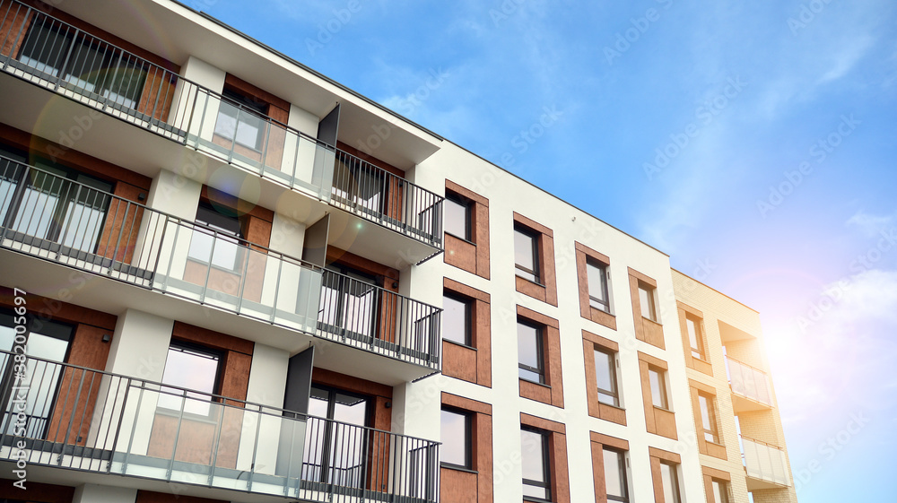 Apartment residential house and home facade architecture and outdoor facilities. Blue sky on the bac