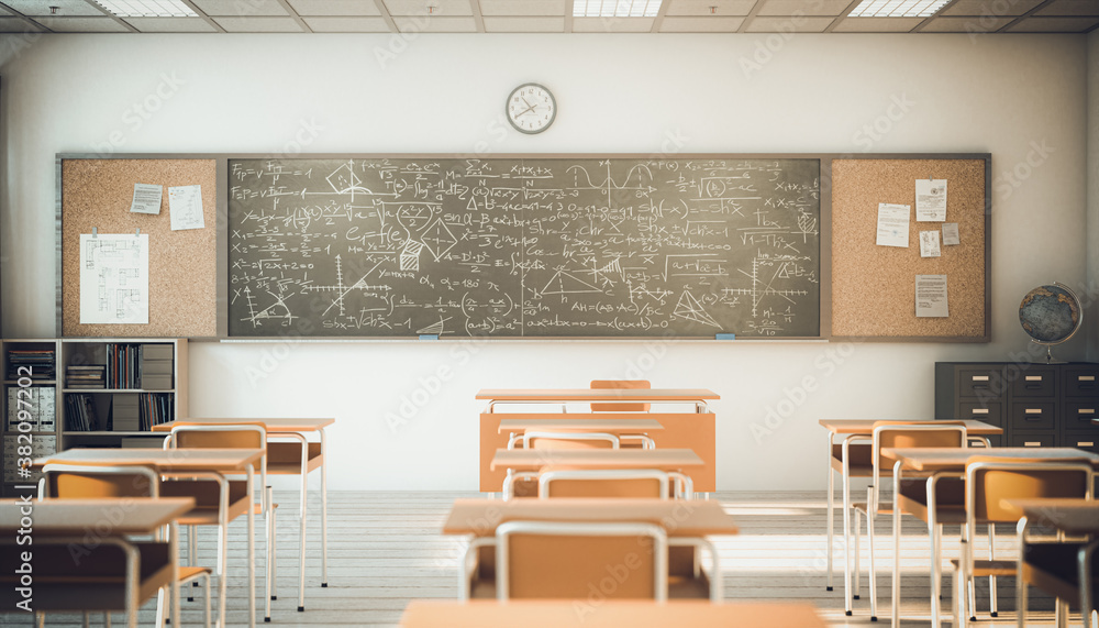 interior of a classroom with wooden desks and chairs