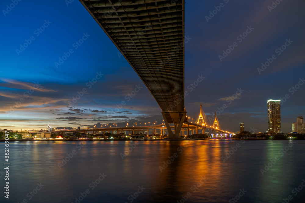 Large suspension bridge over Chao Phraya river at twilight