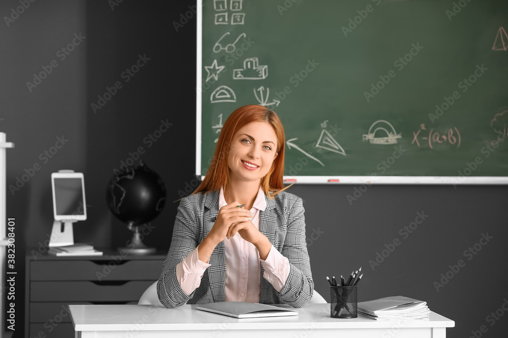 Portrait of beautiful teacher in classroom