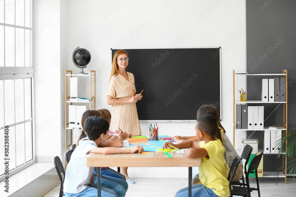 Teacher conducting lesson in classroom