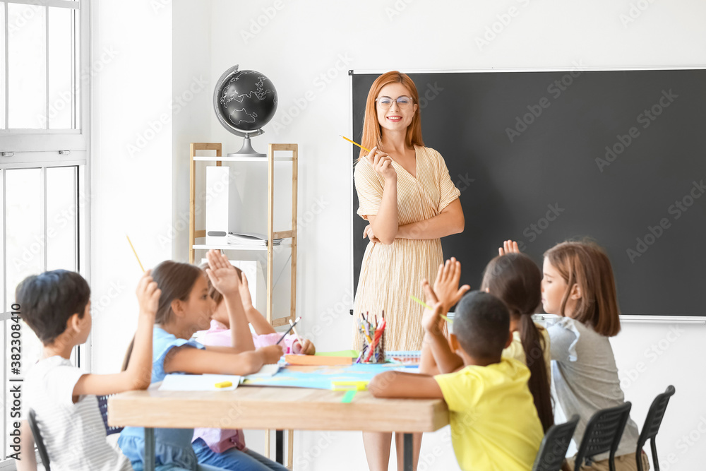 Teacher conducting lesson in classroom