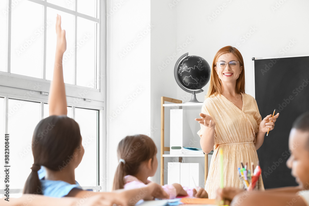 Teacher conducting lesson in classroom