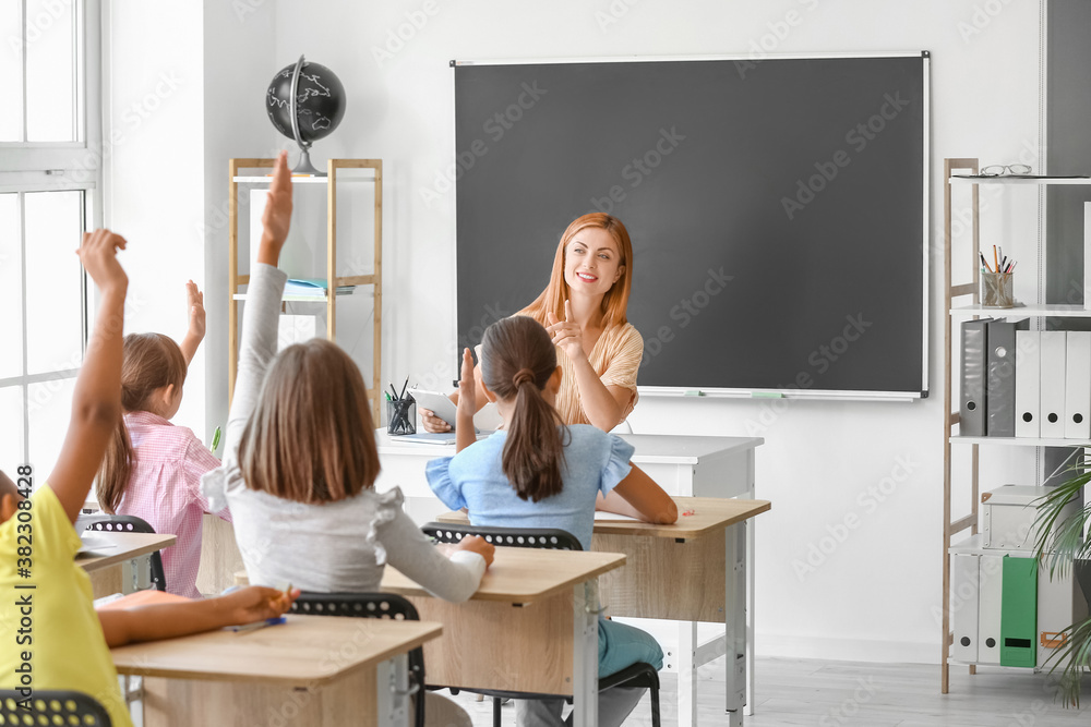 Teacher conducting lesson in classroom