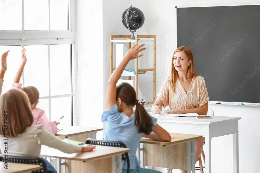 Teacher conducting lesson in classroom