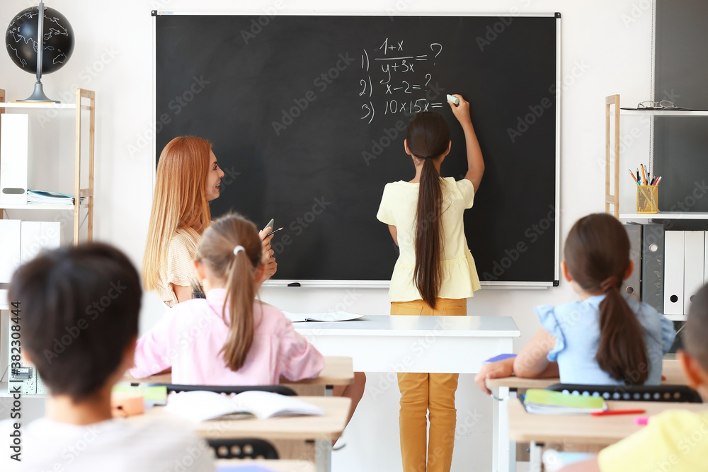 Teacher conducting lesson in classroom