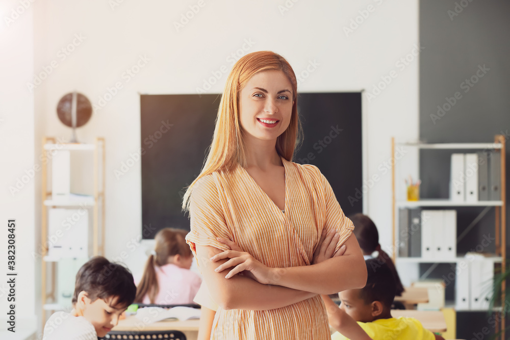 Portrait of beautiful teacher in classroom