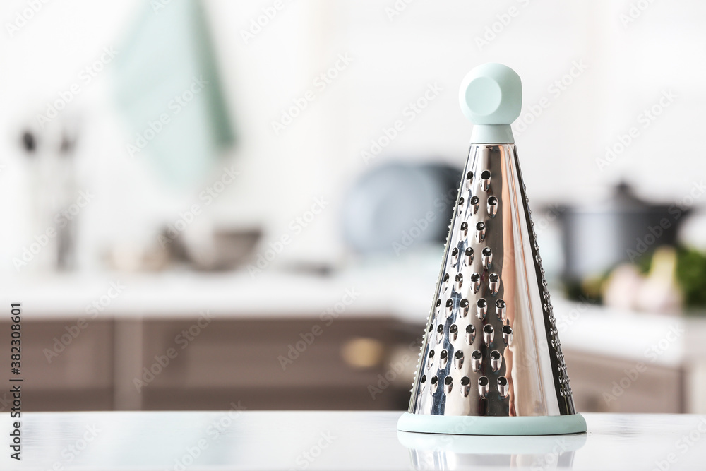 Metal grater on kitchen table