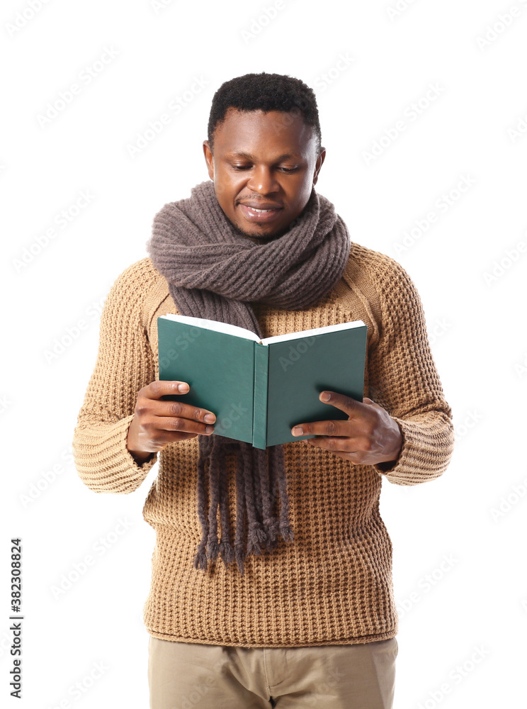 African-American man reading book on white background