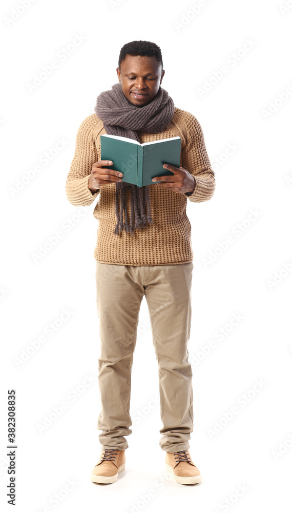 African-American man reading book on white background