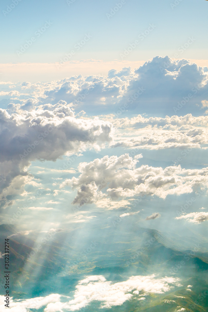 Panoramic view above the clouds where their training is, the passage of the suns rays and the earth